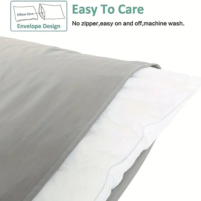 Gray and white pillowcases shown in an envelope design with a pillow core.