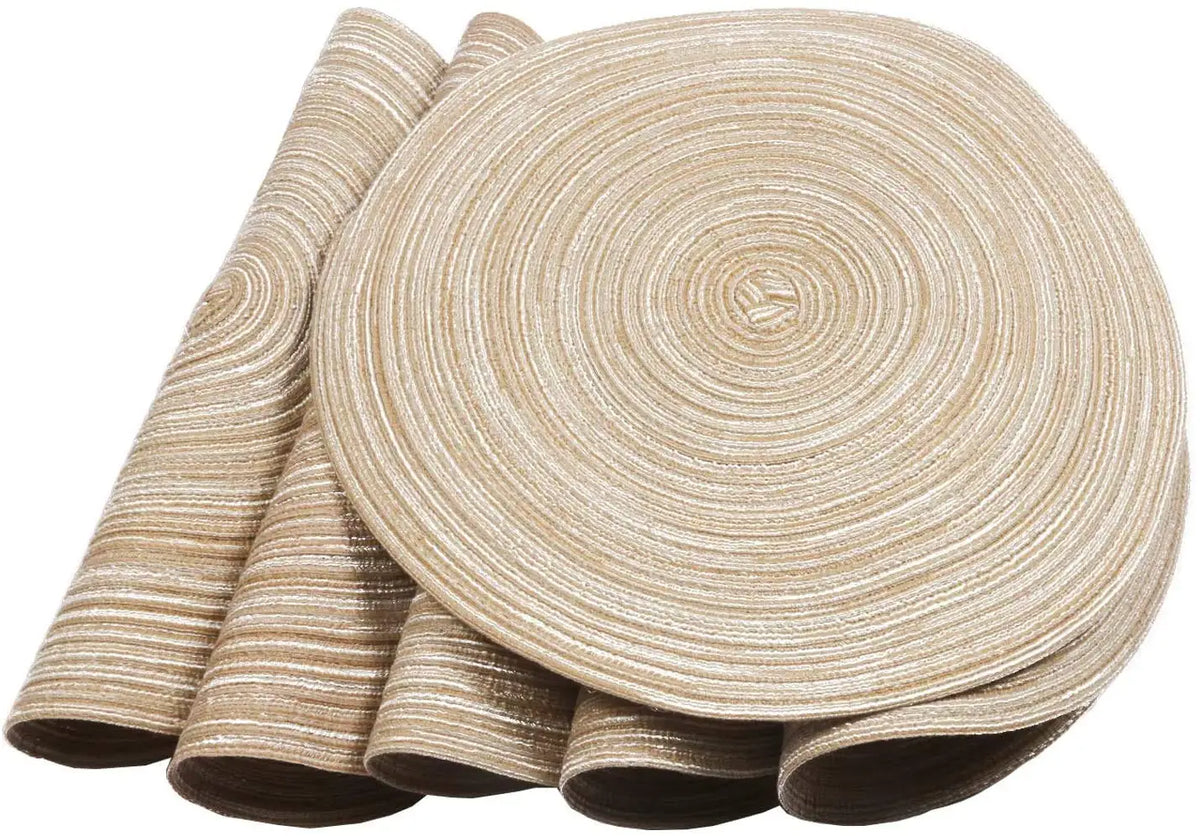 A set of six round, beige braided placemats rolled up for dining and party decor.