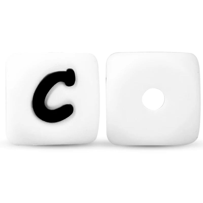 A white silicone alphabet bead shaped like the letter C with a circular hole.