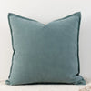 A solid teal chenille throw pillow cover with a textured fabric.