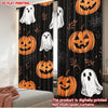 Black curtain panels featuring orange Halloween pumpkins and white ghosts printed on them