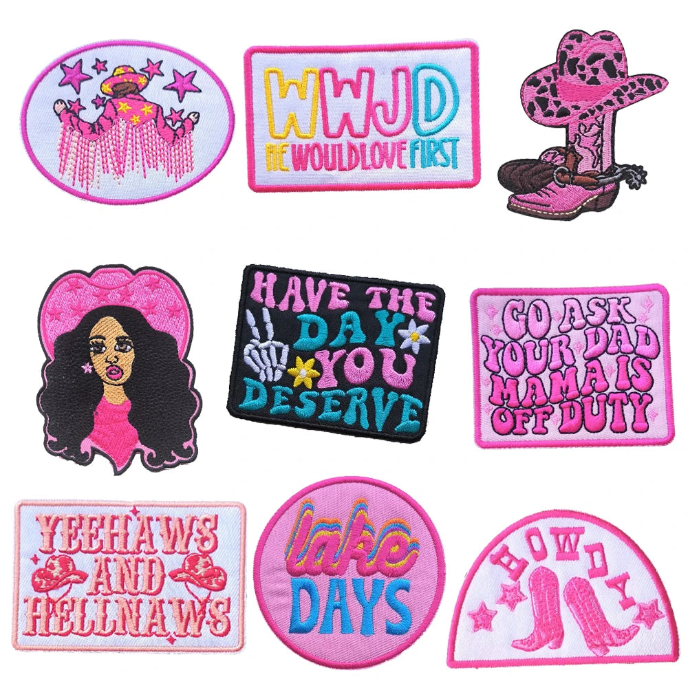 A collection of iron-on embroidered letter patches featuring various phrases and designs like WWJD and Have The Day You Deser