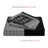 Two pillowcases without core and one duvet cover without filler featuring a crown design on black and gray fabric.