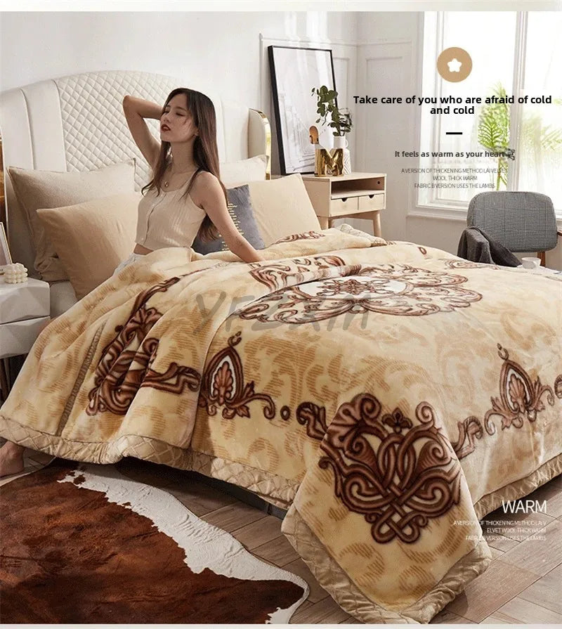 A beige weighted blanket is draped over a bed, with a woman sitting beside it in a bright bedroom.