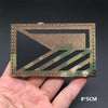 A rectangular tactical flag patch featuring a camouflage pattern on a dark background.