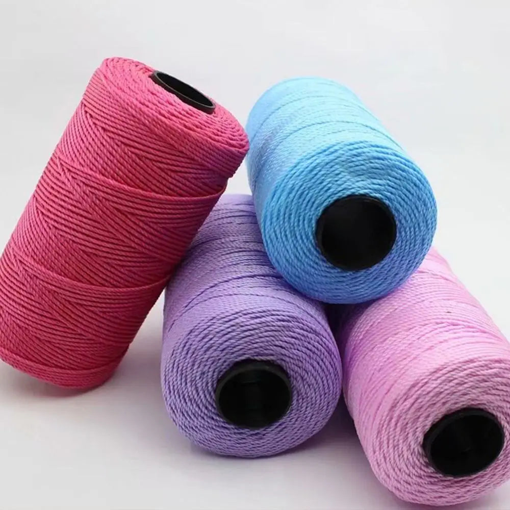 Three spools of pink, blue, and purple 1.5mm cotton silk thread for knitting and crafting