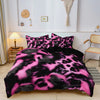 A black and pink leopard print duvet cover set displayed on a bed in a bright room.