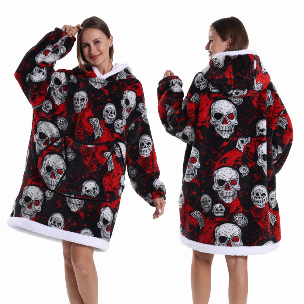 A woman models a black and red patchwork fleece hoodie with skull designs.