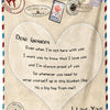 A beige knit blanket featuring a heart design and text expressing love and pride for a grandpa