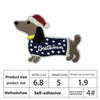 An embroidered dog patch in brown and black colors with a red hat.