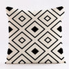 A geometric black and white patterned throw pillow cover