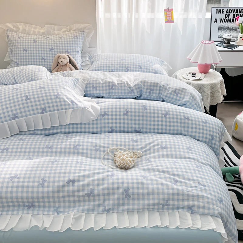 A bed with a floral bowknot duvet cover set featuring blue and white gingham patterns.