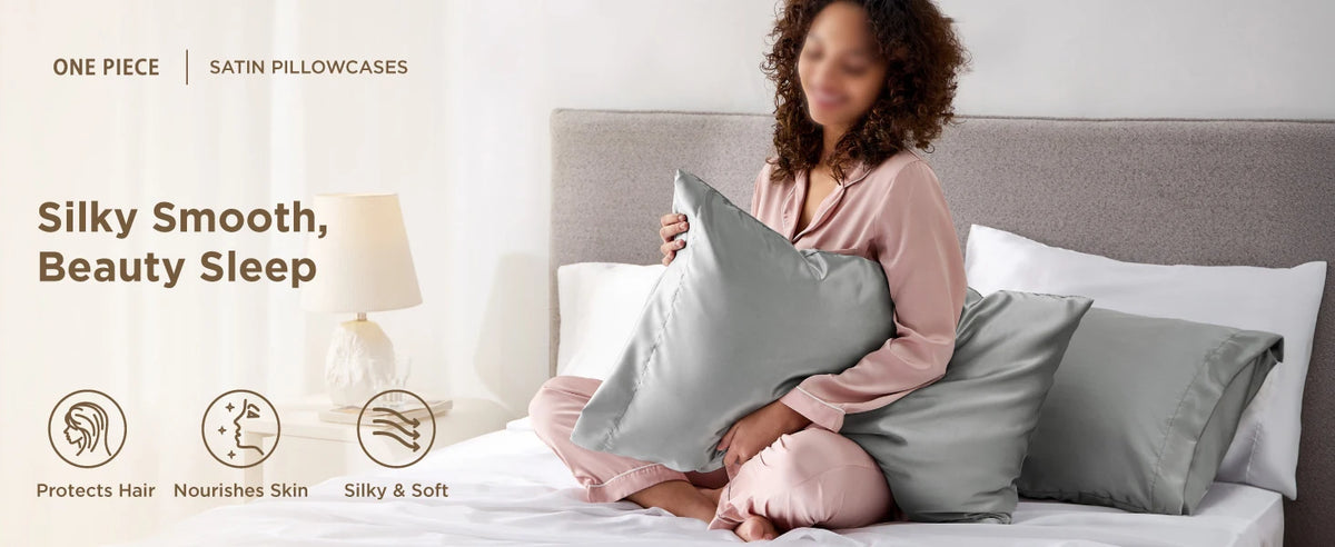 A woman rests on a bed with two satin pillowcases, demonstrating silky smooth beauty sleep.