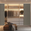 A modern closet interior featuring a magnetic accordion pleated door curtain dividing the space.