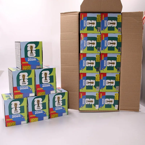 A stack of football stickers for the 2026 FIFA World Cup, packaged in brown cardboard boxes.