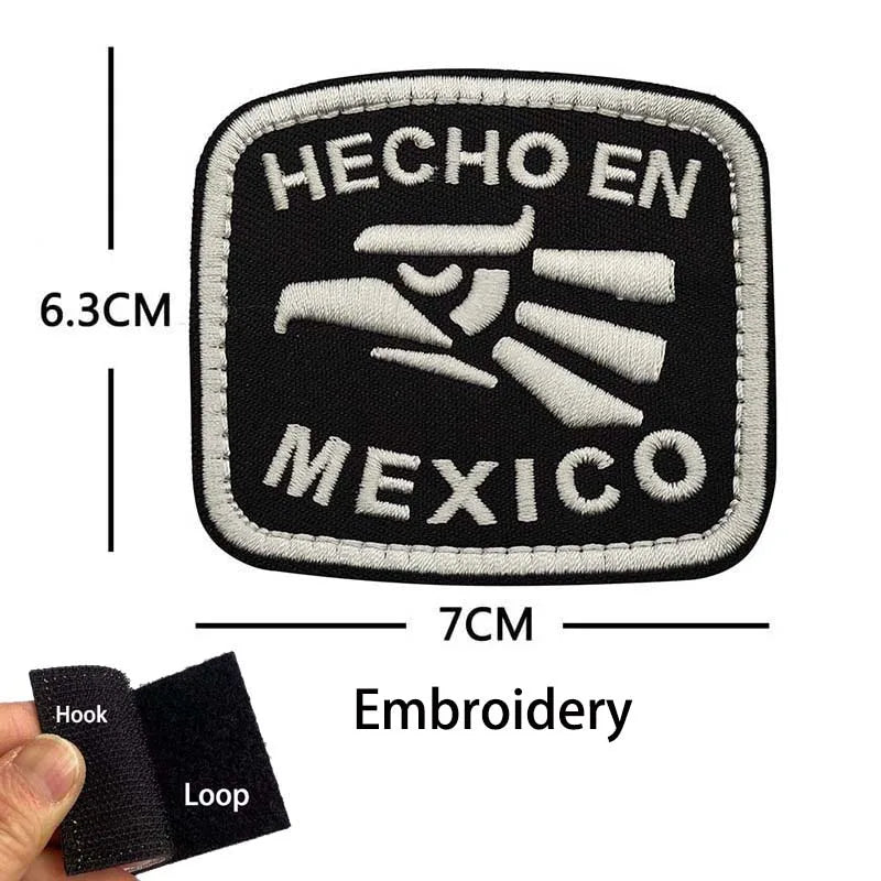 Black embroidery patch with white text 'HECHO EN MEXICO' and dimensions 6.3cm by 7cm