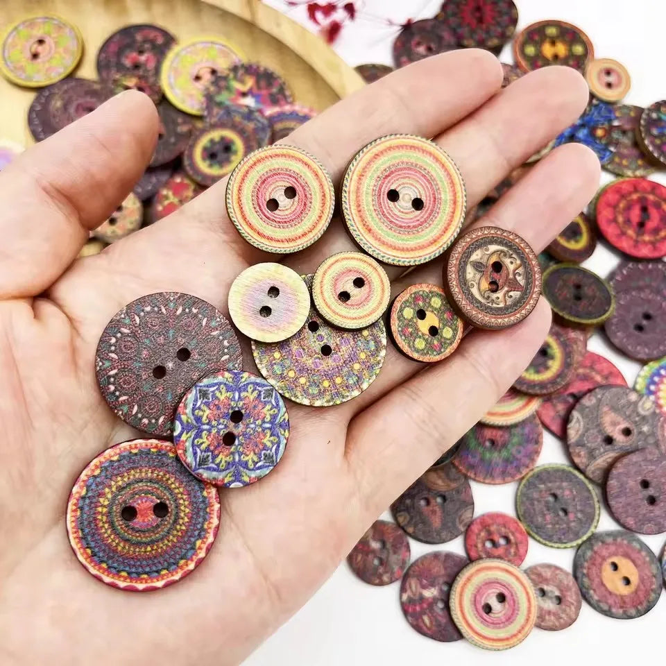A hand holds a collection of colorful vintage wooden buttons for craft projects.
