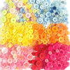 A colorful assortment of resin sewing buttons in various shades including yellow, orange, pink, and blue.