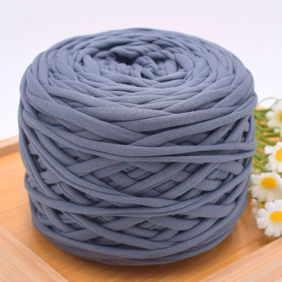 A ball of gray polyester craft yarn used for knitting and DIY projects.