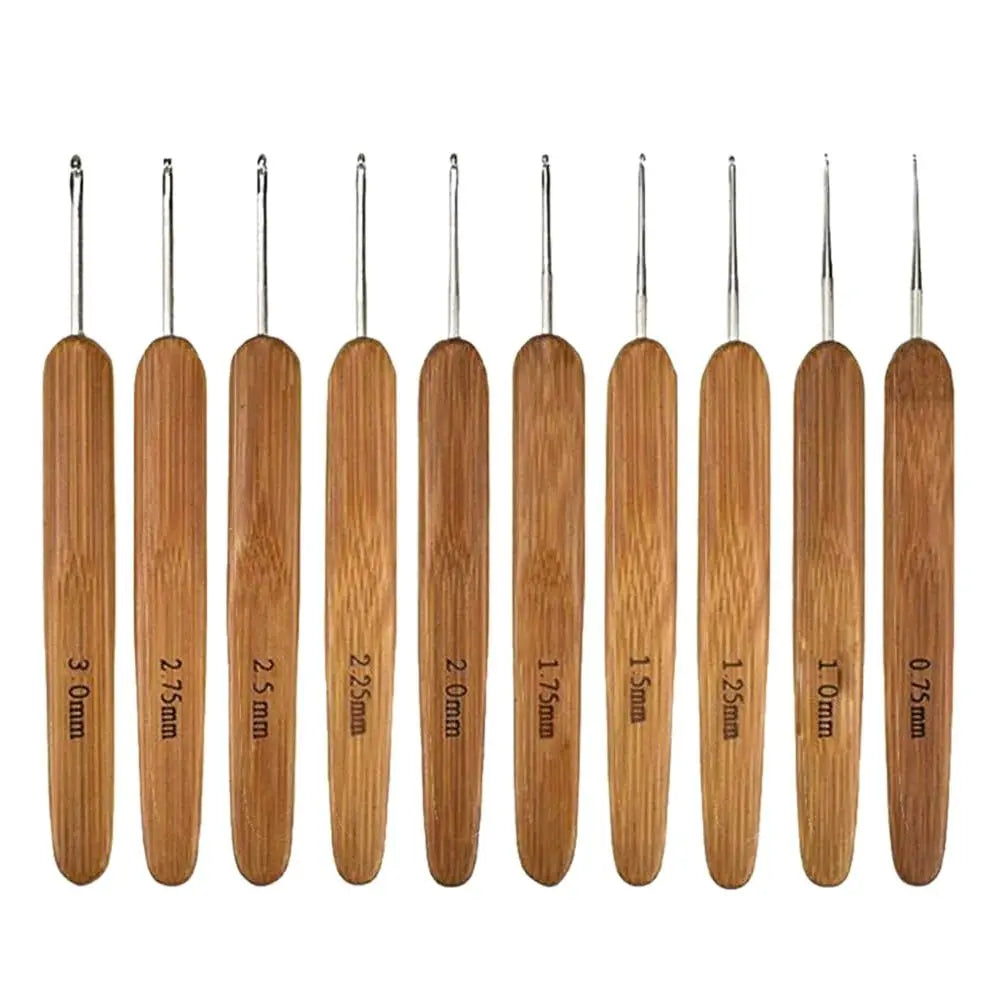 A set of bamboo crochet and knitting needles in various sizes, ranging from 0.75mm to 3.0mm.
