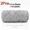 A skein of grey reusable elastic yarn is shown coiled for crafting.