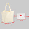 A beige canvas tote bag with handles shown next to an A4 sized card for scale.