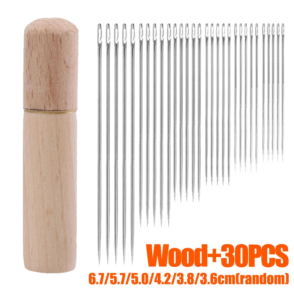 A wooden storage container holds a set of 30 multi-size hand sewing needles with various lengths.