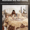 A beige quilted bedspread with brown floral embroidery is displayed on a bed in a bedroom setting.