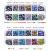 A collection of various colored and sized crystal rhinestones in small plastic compartments.