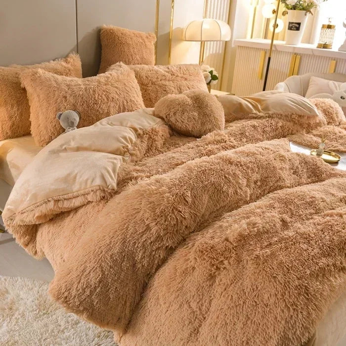 A fluffy, light brown mink velvet duvet set with matching pillows on a bed.