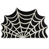 A black and white spider web design on a door mat for Halloween