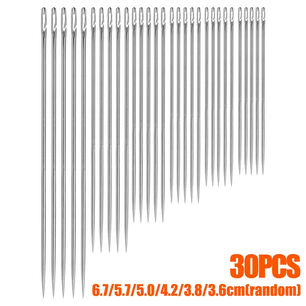 A set of 30 hand sewing needles of various sizes stored in a wooden holder.