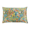 A square pillowcase with a vibrant floral print featuring shades of yellow, orange, green, and blue.