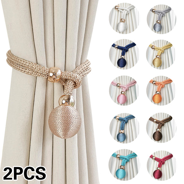 Two sets of adjustable French ball curtain tiebacks in various colors and finishes shown against a light fabric backdrop.