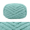 A light mint green hand-knitted wool finger line scarf with a textured, braided pattern.