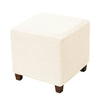 A square ottoman slipcover in off-white with a woven diamond pattern.