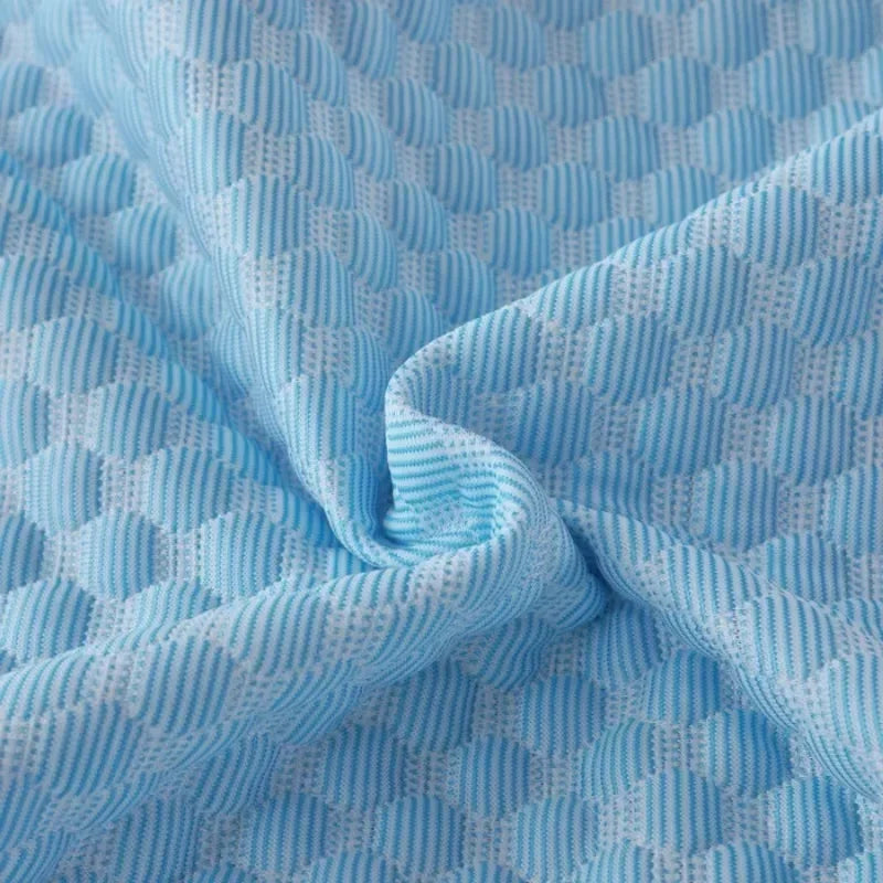 Light blue ice silk cooling pillowcase fabric with a textured, quilted pattern.
