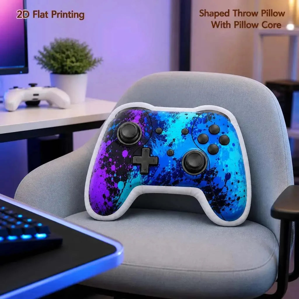 A purple and blue patterned gamer controller plush throw pillow resting on a gray chair.