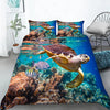 A vibrant digital print of sea turtles swimming in clear blue ocean water used as a duvet cover.