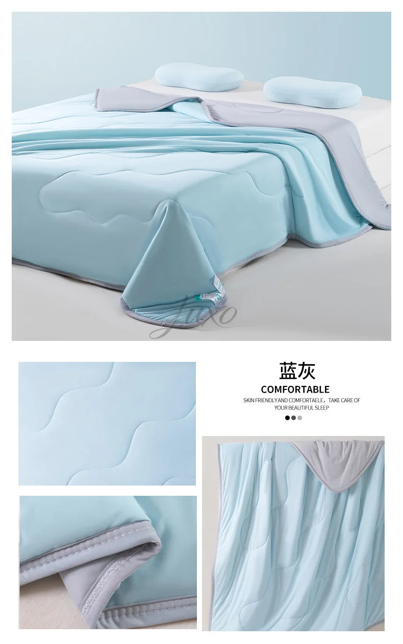 Light blue ice silk summer cooling blanket folded and displayed on a white surface.