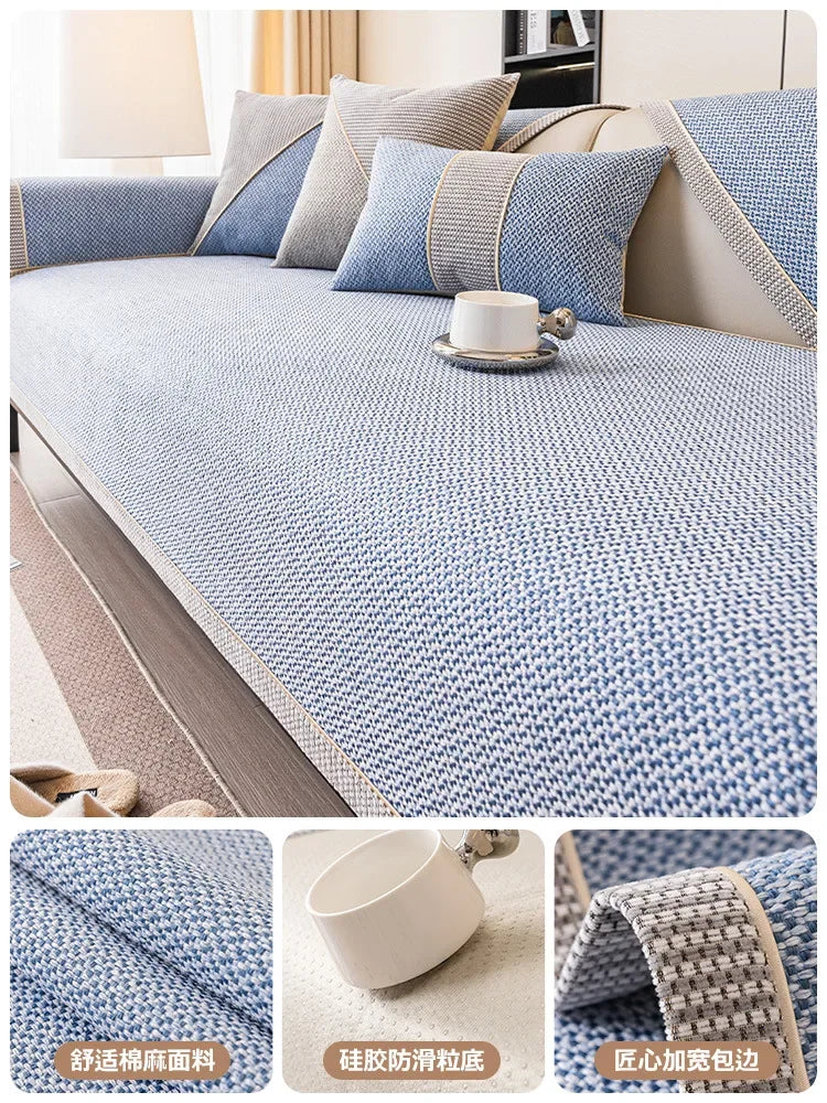 Close-up view of a blue woven sofa cushion cover with beige accents and a white cup on the fabric.