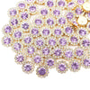 Close-up of gold-toned sunflower crystal rhinestone sew-on buttons arranged in a floral pattern.