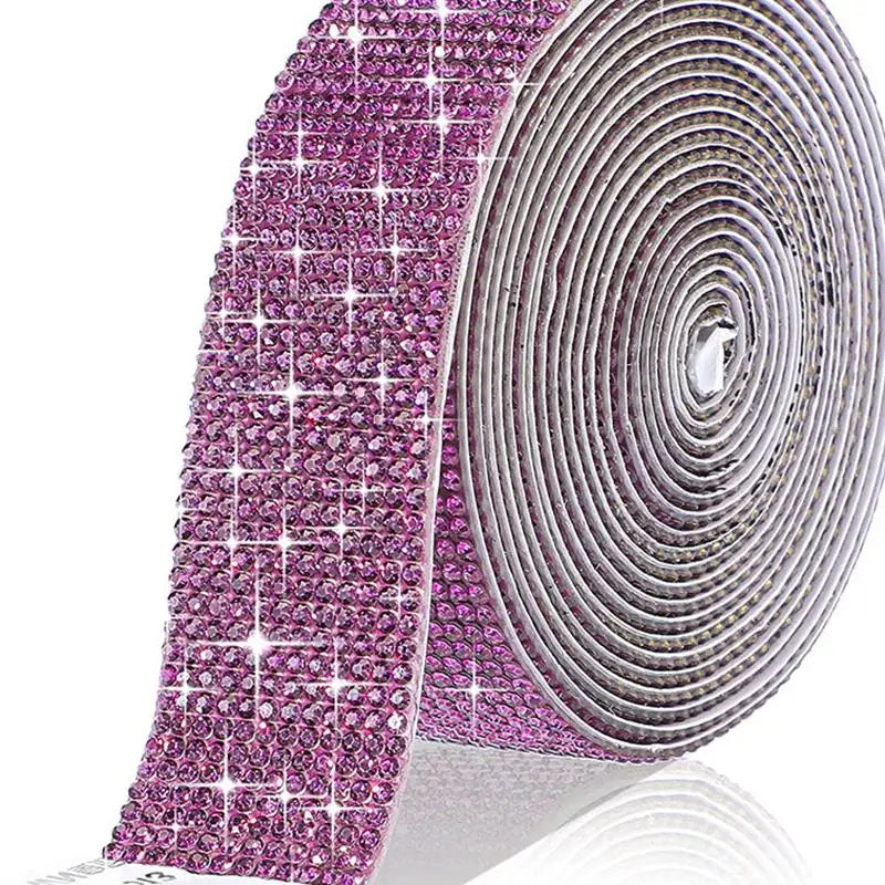 Pink crystal rhinestone sticker ribbon with diamond trim rolled up for crafting and decor