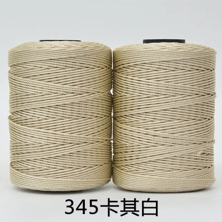 Spool of beige hand knitting and crochet cord for crafting