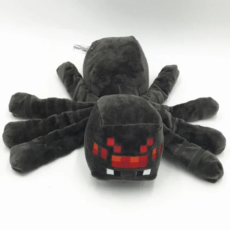 A black stuffed dragon plush toy with glowing red eyes and outstretched limbs.