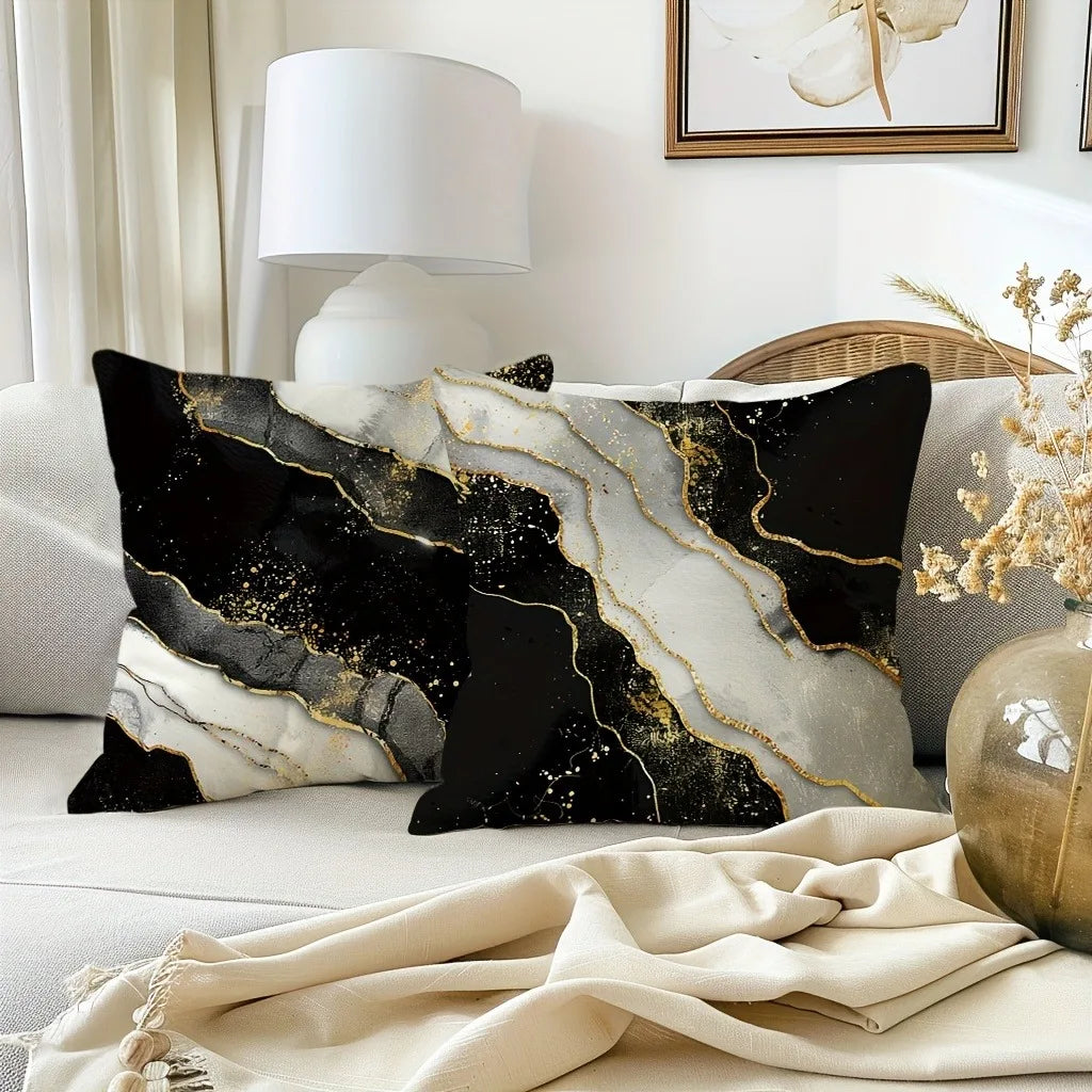 Black and gold marble print decorative pillow cover on a sofa with natural light.