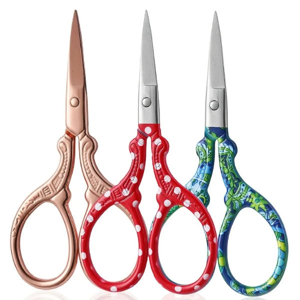 A pair of premium stainless steel embroidery scissors with colorful handles