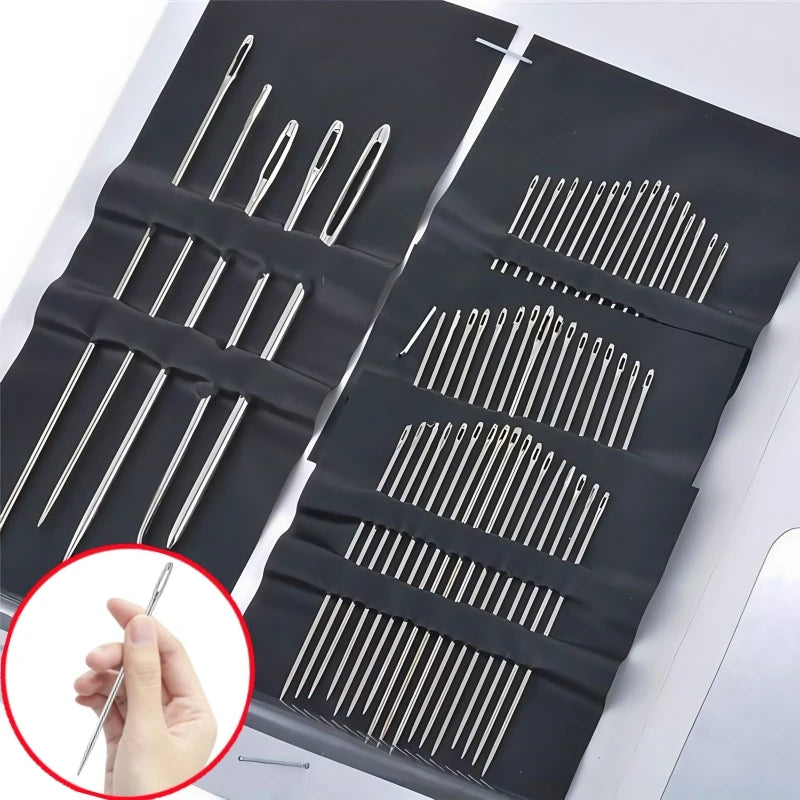A black plastic tray holds a set of stainless steel hand sewing needles arranged in multiple rows.