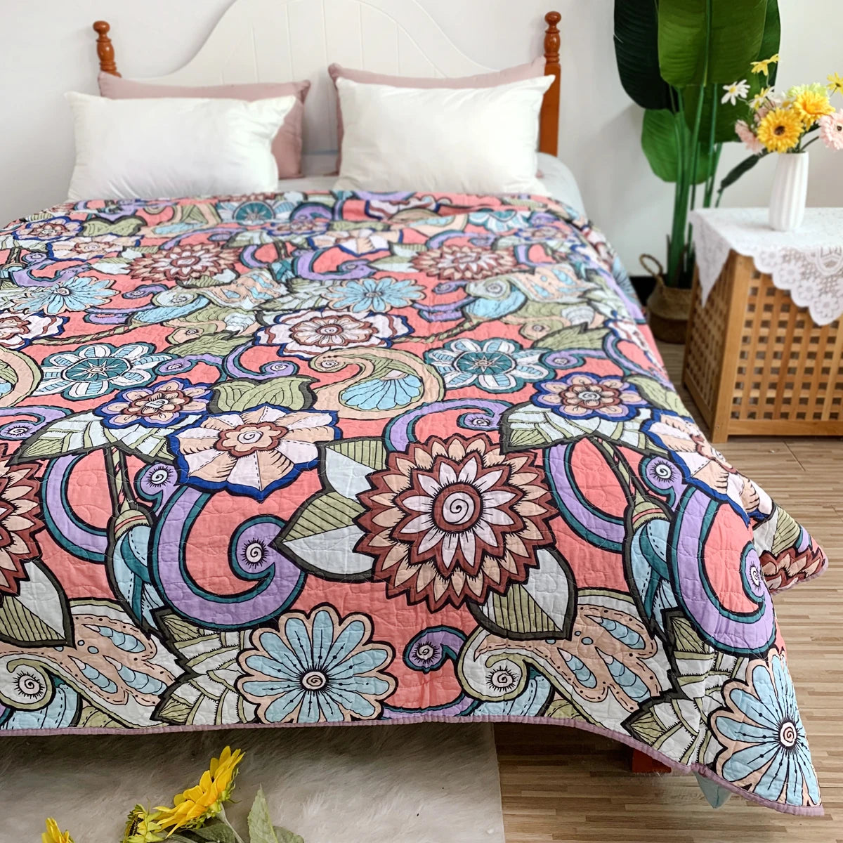 Pastoral embroidered cotton quilted bedspread featuring floral patterns in pink, purple, and green tones.