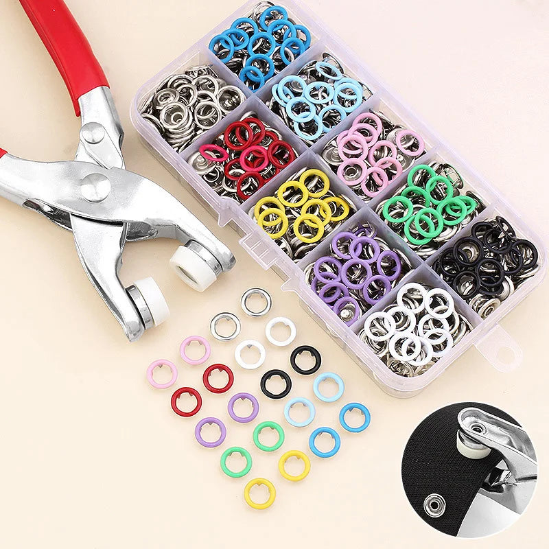 A precision button pliers kit containing various colored metal rings and a red-handled pair of pliers.